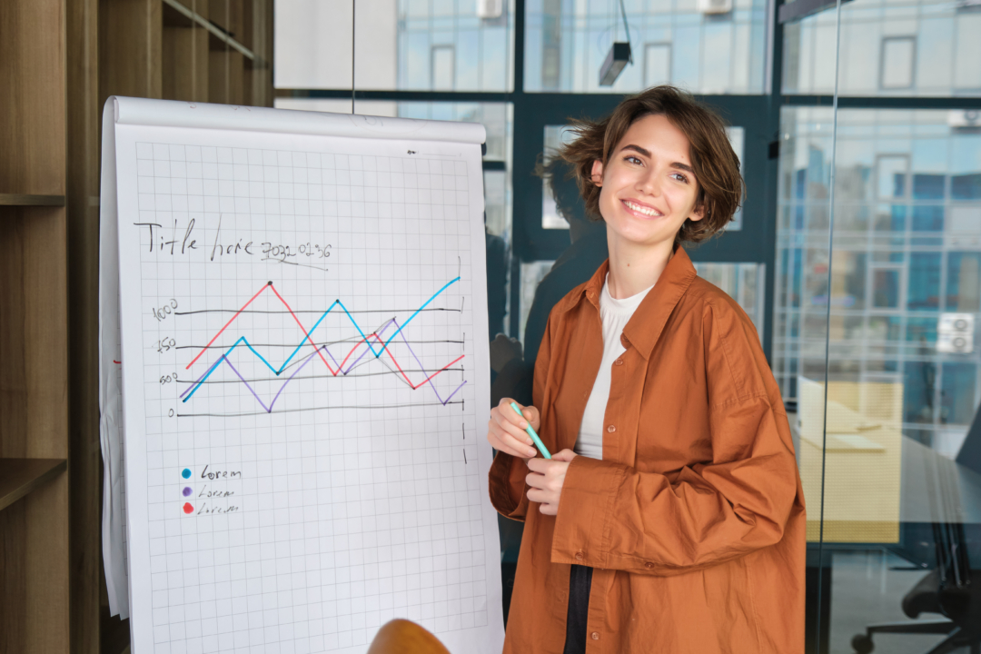 Woman standing in front of a graph